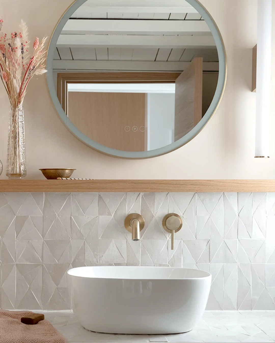 Bathroom backsplash with white geometric zellige tiles